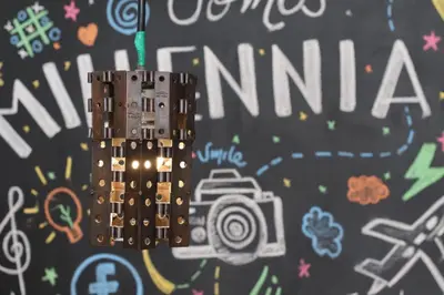 a lego camera attached to a wall with graffiti at Apartahotel Millennials in Manizales
