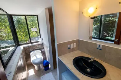 a bathroom with a sink and a toilet at Poblado Guest House in Medellín