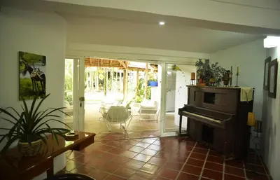 a room with a living room with a piano in it at Alojamiento rural el Refugio en santagueda in Santagueda