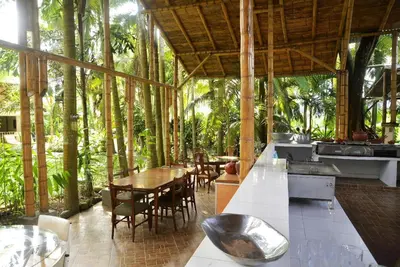 a restaurant with a table and chairs and trees at Alojamiento rural el Refugio en santagueda in Santagueda