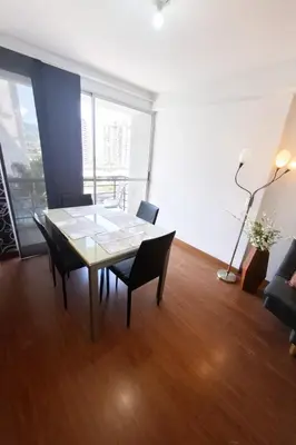 a dining room with a table and chairs in a room at Apartamento En Sabaneta in Sabaneta