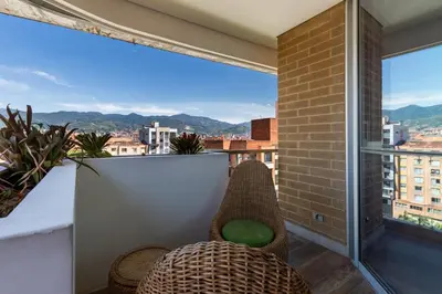a balcony with a view of a city at Terra Biohotel in Medellín