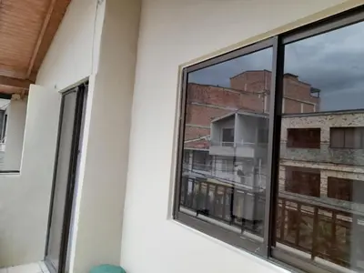 a window in a room with a view of a building at Amoblado centro de la Moda in Itagüí