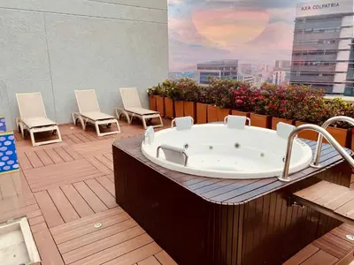 a bath tub sitting on top of a building at Hampton by Hilton Medellin in Medellín