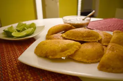 a plate of food with donuts on a table at Casamarilla in Mariquita