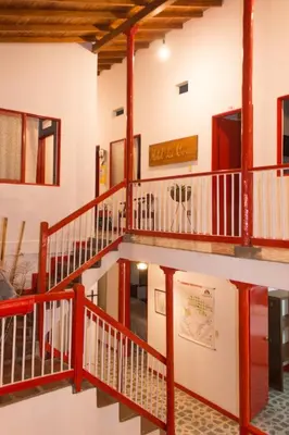 a staircase in a building with wooden beams at Hotel La Casona in Jardin