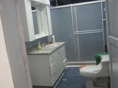 a bathroom with a sink and a toilet and a shower at ANGIE`s HOUSE in Manizales