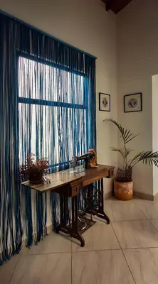 a bathroom with a sink and a large window at La Casa Del Sol in Jardin