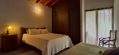 a bedroom with a bed and a window at La Casa Del Sol in Jardin