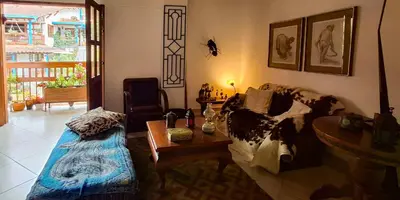 a living room with a couch and a table at La Casa Del Sol in Jardin
