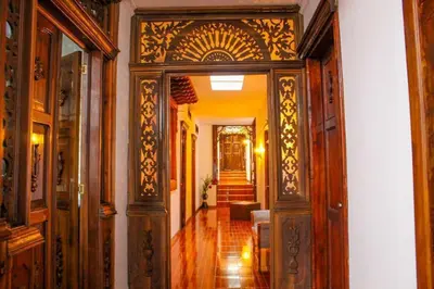 an ornate doorway to a hallway in a house at Las Marías Family Home - Urbano & Campestre in Salamina