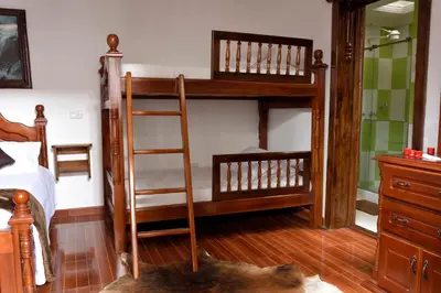 a bedroom with two bunk beds and a ladder at Las Marías Family Home - Urbano & Campestre in Salamina