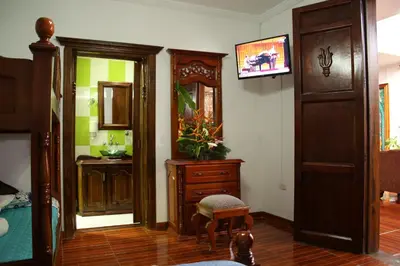 a living room with a dresser and a mirror at Las Marías Family Home - Urbano & Campestre in Salamina