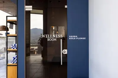 a hallway with a wellness room sign on the door at Soul Lifestyle Hotel in Medellín