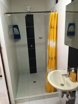 a bathroom with a shower and a sink at Hotel Internacional Jardín in Jardin