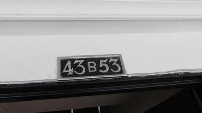 a license plate on the back of a car at The Lofts @ 11 in Medellín