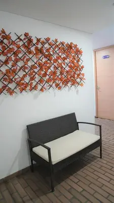 a bench in a room with a painting on the wall at Hotel Salamanca Resort in Itagüí