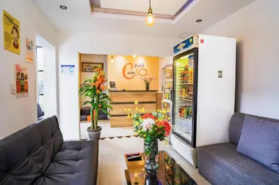 a store with a couch and flowers on a table at Hotel Casa 10 in Medellín