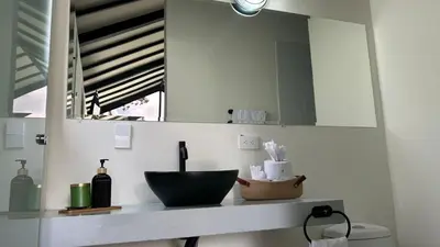 a bathroom counter with a mirror and a sink at STAR CENTER Hotel Boutique in Rionegro