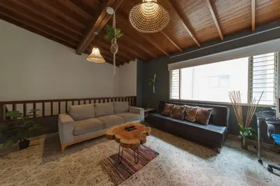 a living room with a couch and a table at Living Hotel in Medellín