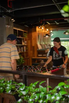 two people standing at a counter in a store at Rango Hostel Boutique in Medellín