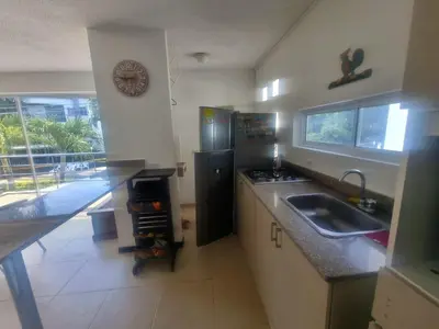 a kitchen with a sink and a counter top at Ciudadela Santafe in Santa Fe de Antioquia