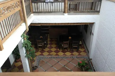 an overhead view of a balcony with a table and chairs at Sergeant Pepper's Hostel in Jardin