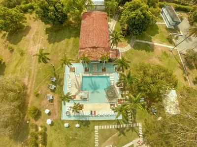 an aerial view of a house with a swimming pool at Arena de Santa Fe by Bernalo Hotels in Santa Fe de Antioquia