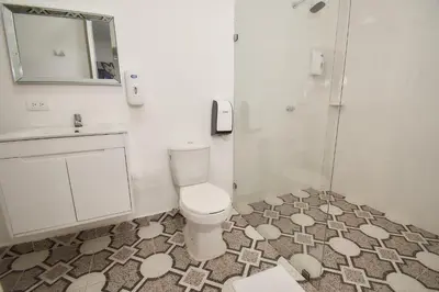 a bathroom with a toilet and a sink and a shower at Arena de Santa Fe by Bernalo Hotels in Santa Fe de Antioquia