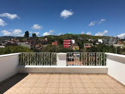 a balcony with a view of a city at Hotel Bahia Guatape in Guatapé