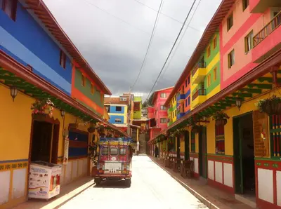a narrow street with colorful buildings at Hotel Las Vegas in Guatapé