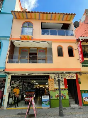 a building with a store in front of it at Hotel Las Vegas in Guatapé