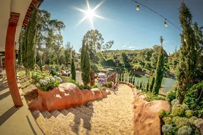 a view from the balcony of a house with plants and trees at Mansión by Bernalo Hotels in Guatapé