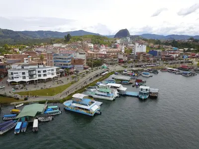 an aerial view of a harbor with boats in the water at Hotel Portobelo Guatape in Guatapé
