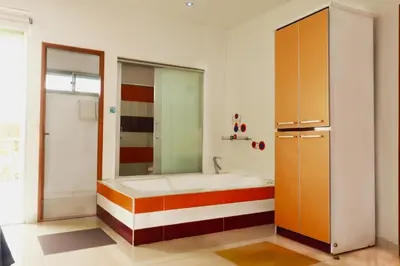 a bathroom with a bath tub in a room at Hotel Portobelo Guatape in Guatapé