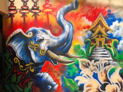 a painting of an elephant on the side of a wall at Lake View Hostel in Guatapé