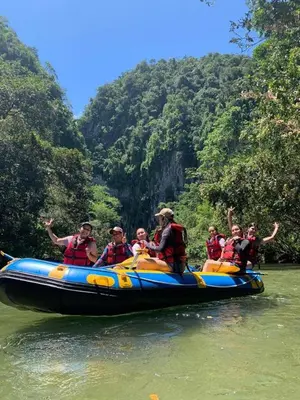 a group of people on a raft in the river at Biohotel Rio Claro in Doradal