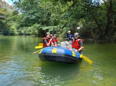 a group of people in a raft on a river at Biohotel Rio Claro in Doradal
