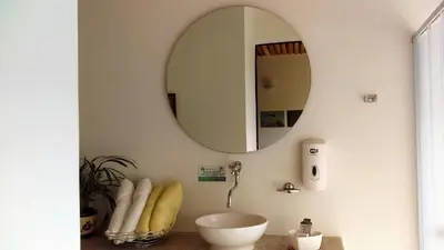 a bathroom with a sink and a mirror at Hotel Termales Tierra Viva in Manizales