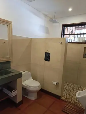 a bathroom with a toilet and a sink at Finca Boutique el Diamante in Salgar