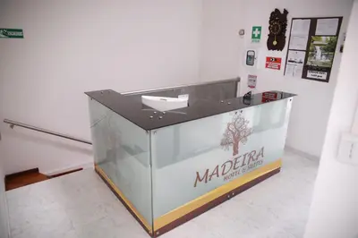 a kiosk with a sign on it in a room at Hotel Madeira in Manizales