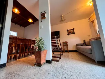 a living room with a couch and a table at Cabaña La Aldea - Santorini Colombiano in Doradal