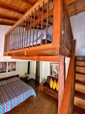 a bedroom with a bunk bed and a loft at Finca Turística de Alojamiento Rural Avalon in Jardin