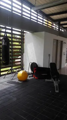 a room with a gym with a yellow ball on the floor at Apartasol de Lujo Santa Fe de Antioquia