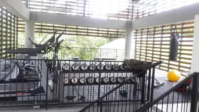a balcony with a bunch of wine glasses on it at Apartasol de Lujo Santa Fe de Antioquia