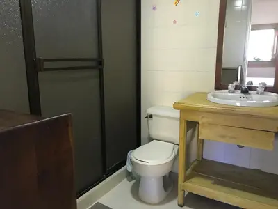 a bathroom with a toilet and a sink at La Kolorina hotel campestre in Jericó