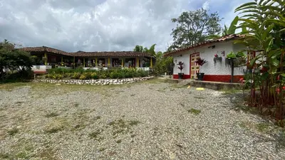 a house with a gravel yard in front of it at La Kolorina hotel campestre in Jericó