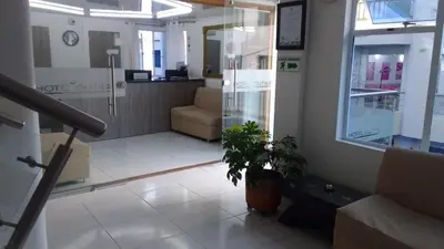 a lobby of a store with a potted plant at Hotel Gutier Rionegro in Rionegro