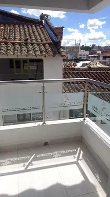 a balcony of a building with a roof at Hotel Gutier Rionegro in Rionegro