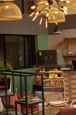 a kitchen with a table and chairs and a counter at Epic Boutique Hotel in Medellín